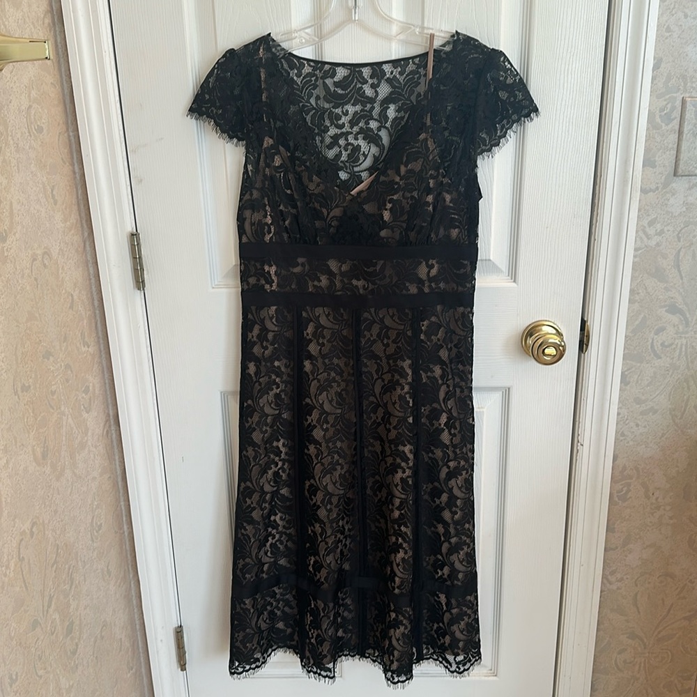 Black lace cocktail dress with tan shell.  Size 8P.
